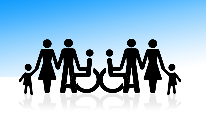 An image of disability logos on a blue background with a group of people in silhouette 